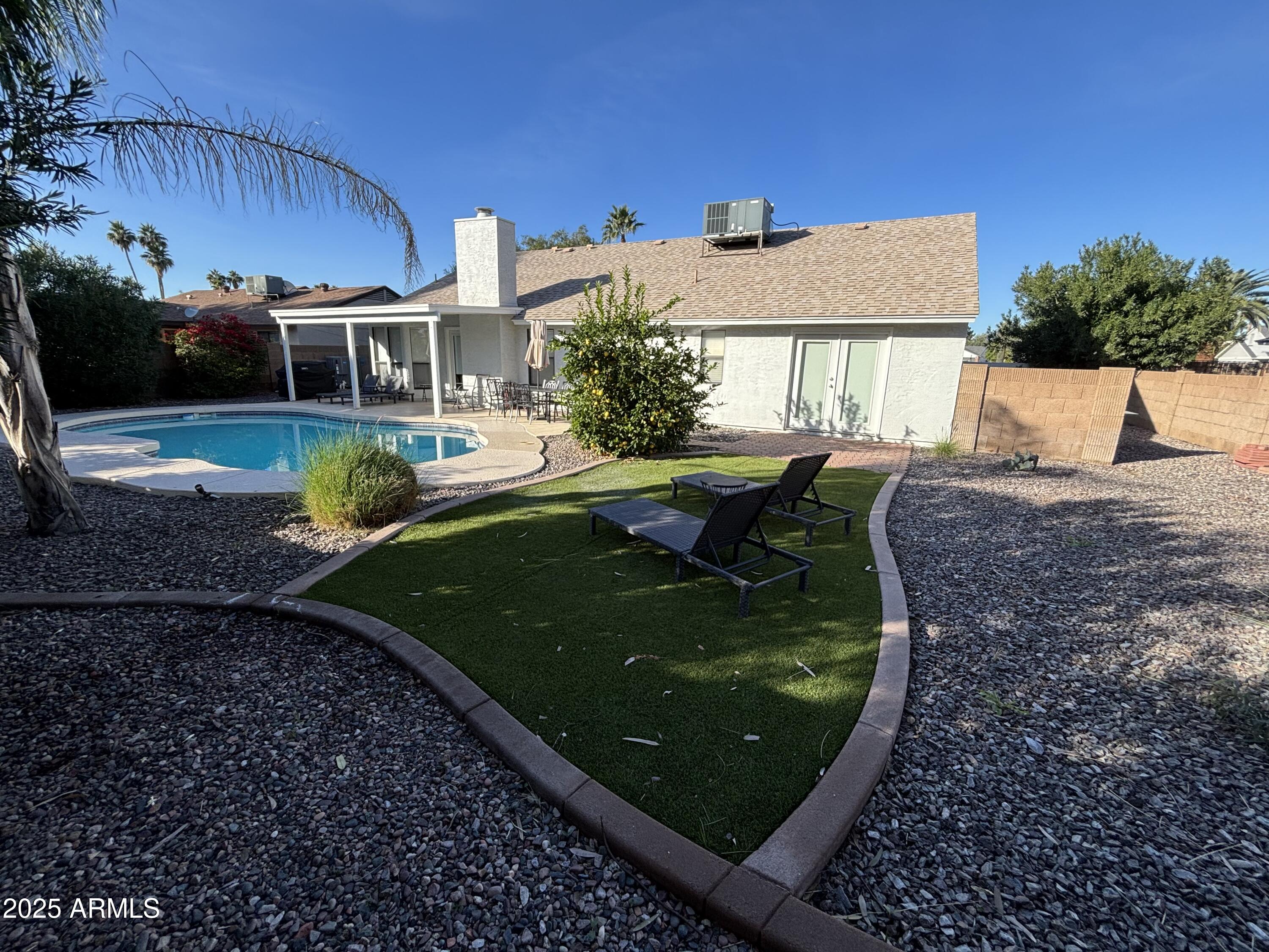 6521 East Grandview Drive Scottsdale, AZ 85254 - Photo 3 of 27 a view of a house with backyard