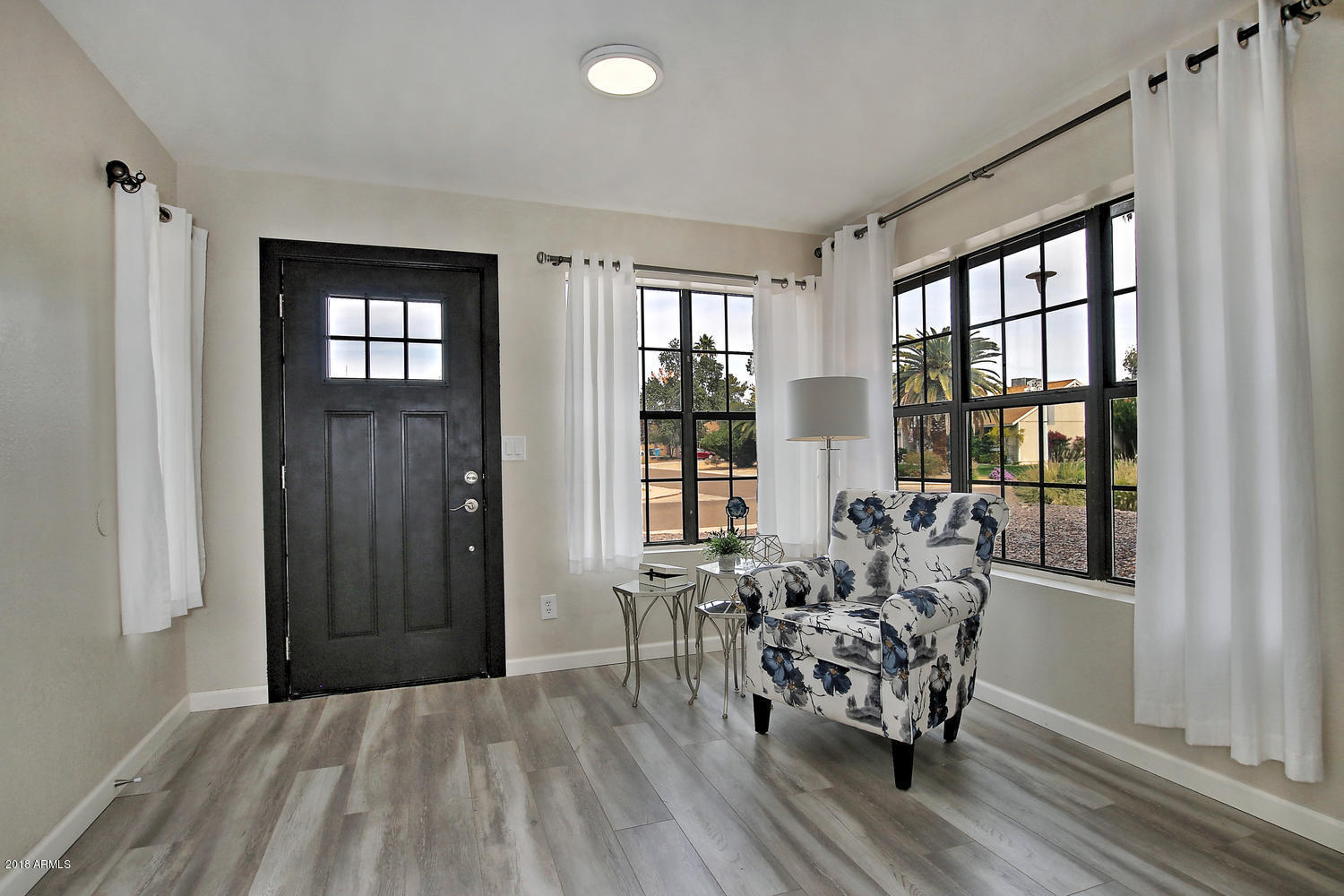 6521 East Grandview Drive Scottsdale, AZ 85254 - Photo 4 of 27 a dining room with furniture and wooden floor