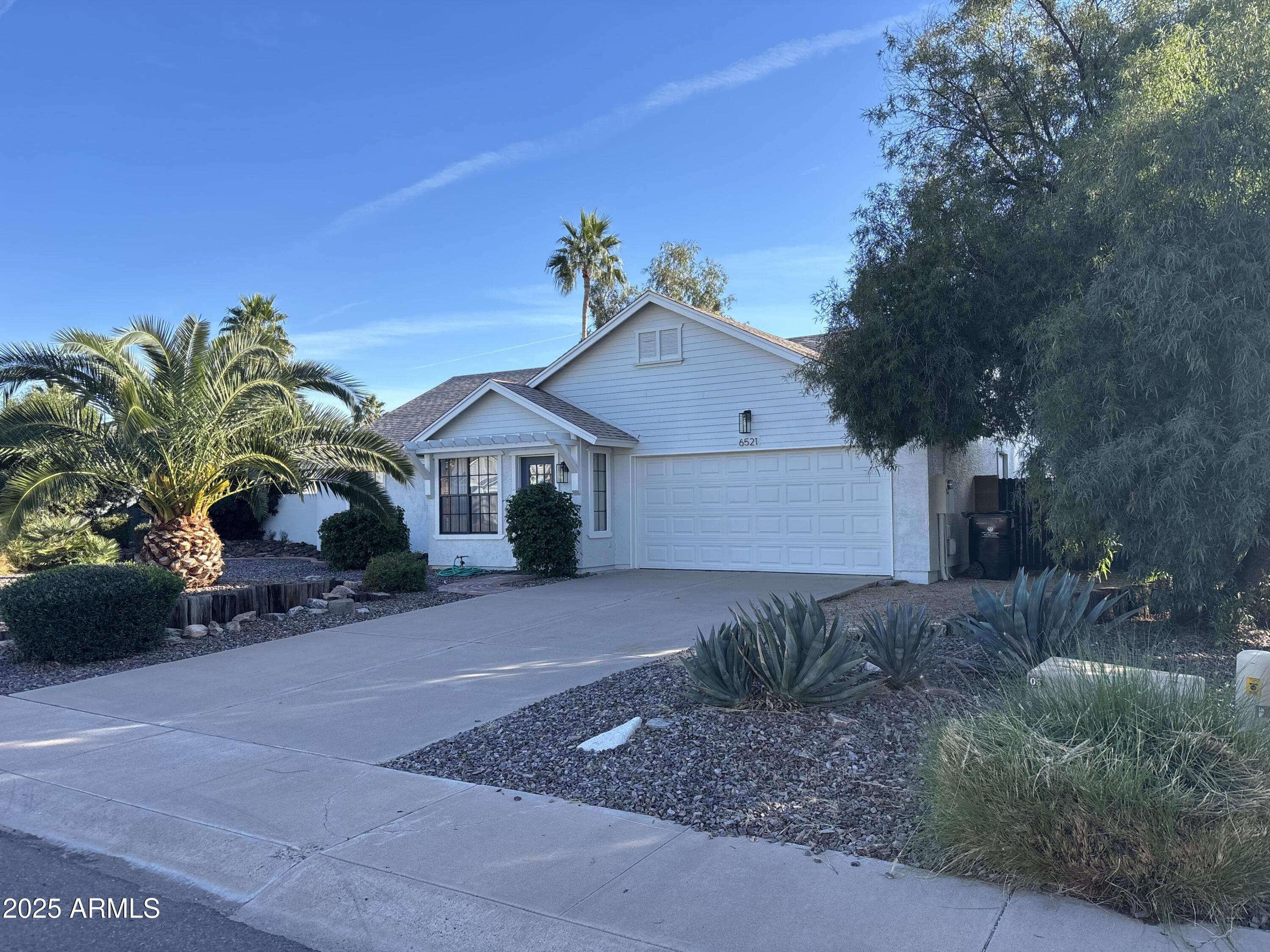 6521 East Grandview Drive Scottsdale, AZ 85254 - Photo 6 of 27 a house view with a garden space