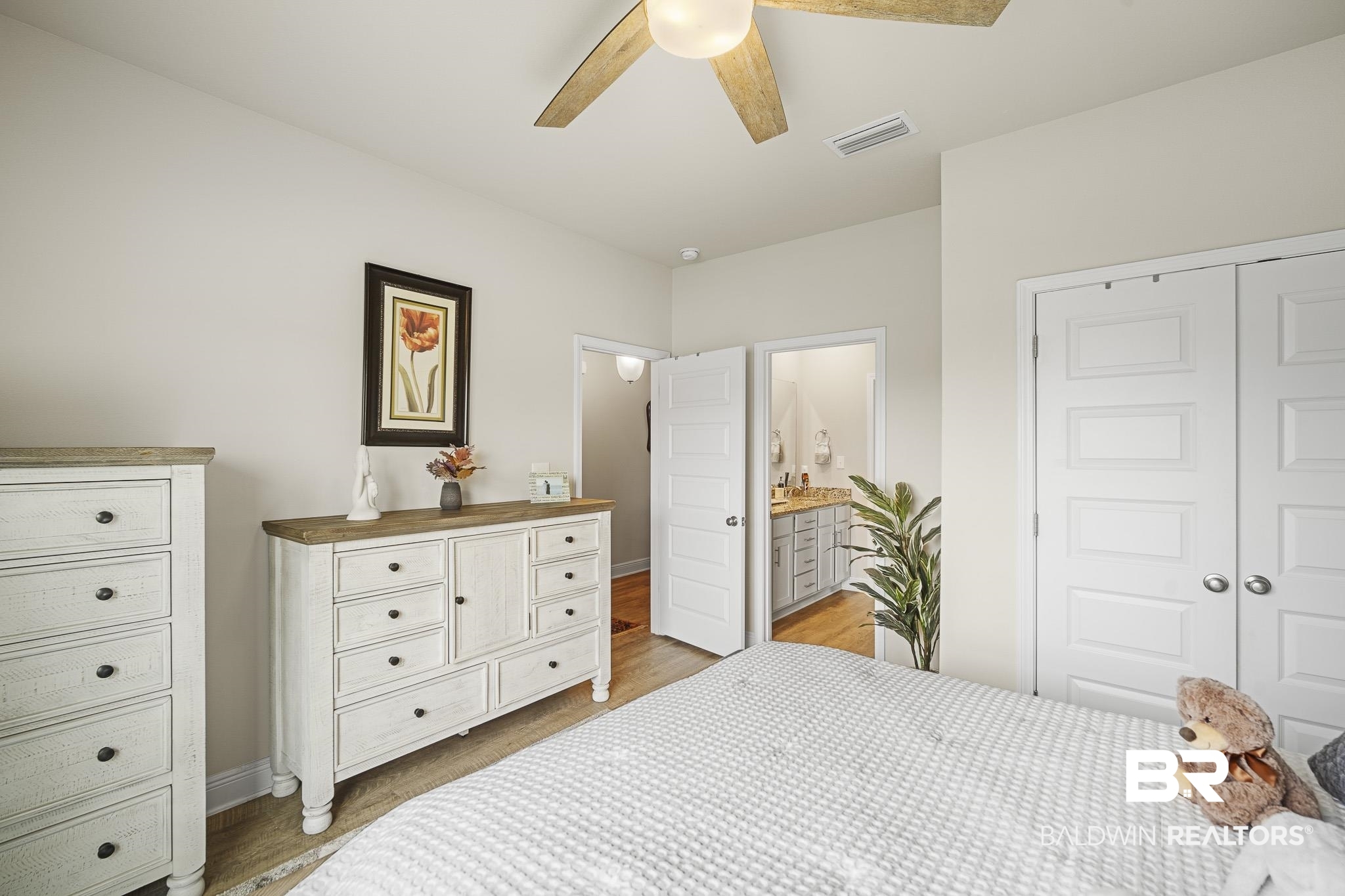 24765 Spectacular Bid Loop Daphne, AL 36526 - Photo 28 of 45 Bedroom with ceiling fan, ensuite bathroom, dark hardwood / wood-style floors, and a closet
