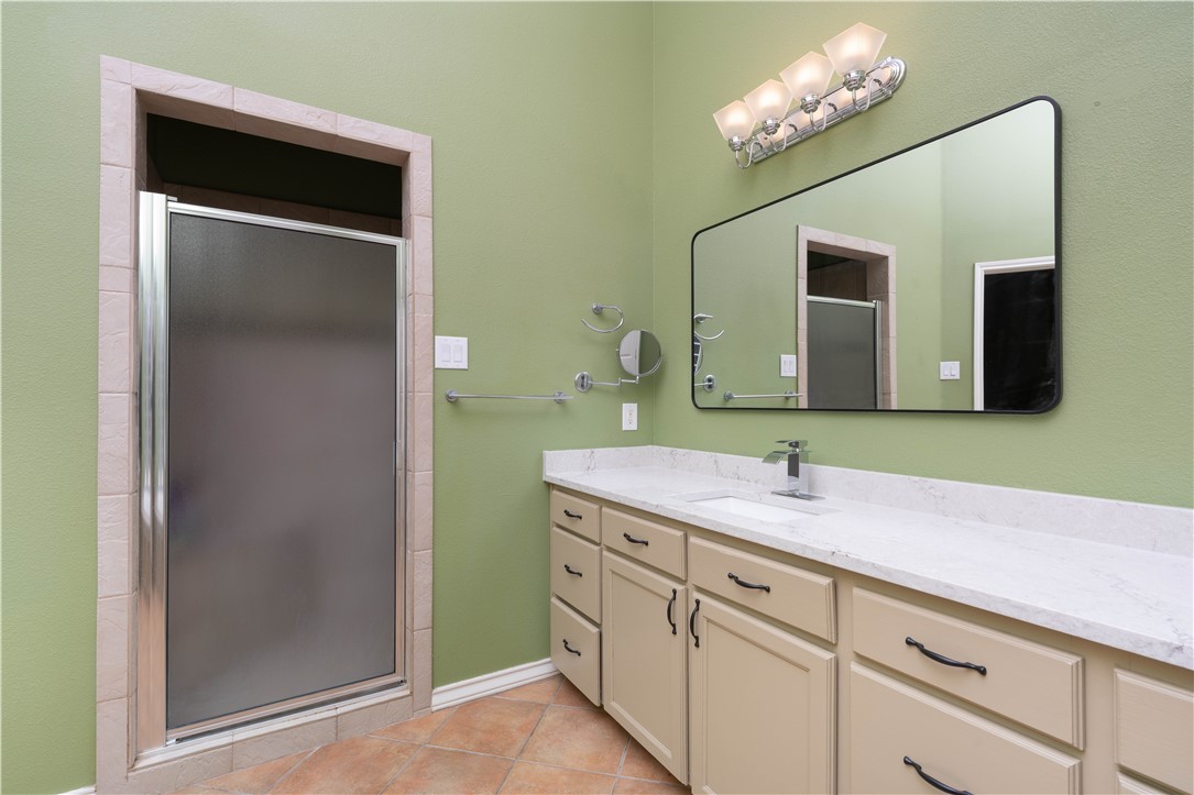 1034 Graham Road Corpus Christi, TX 78418 - Photo 12 of 40 a bathroom with a sink and a mirror