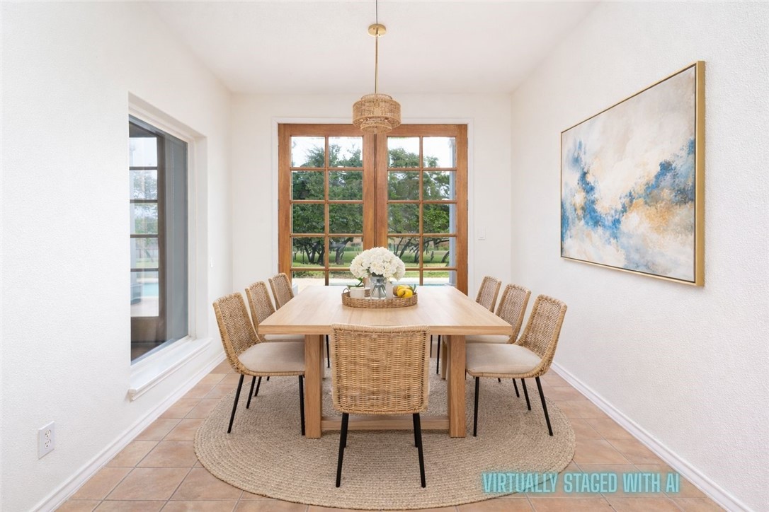 1034 Graham Road Corpus Christi, TX 78418 - Photo 22 of 40 a dining room with furniture a rug and wooden floor