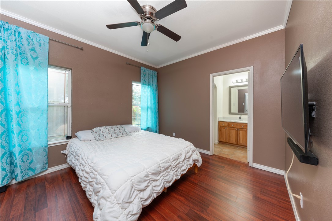 1034 Graham Road Corpus Christi, TX 78418 - Photo 25 of 40 a bedroom with a bed and a flat screen tv