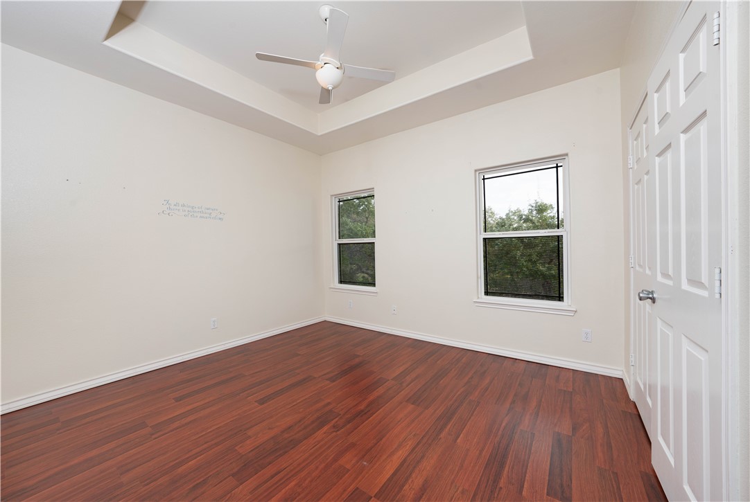 1034 Graham Road Corpus Christi, TX 78418 - Photo 31 of 40 an empty room with wooden floor and windows