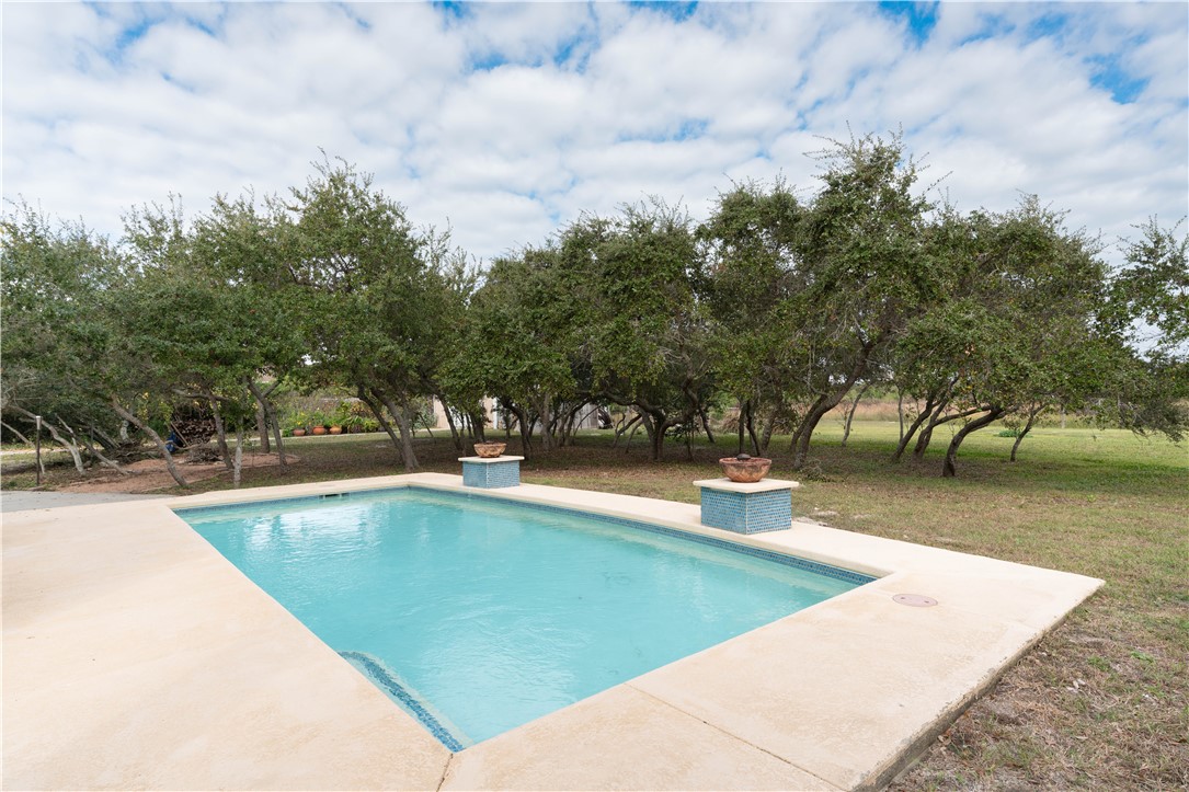 1034 Graham Road Corpus Christi, TX 78418 - Photo 36 of 40 a view of a swimming pool with an outdoor seating
