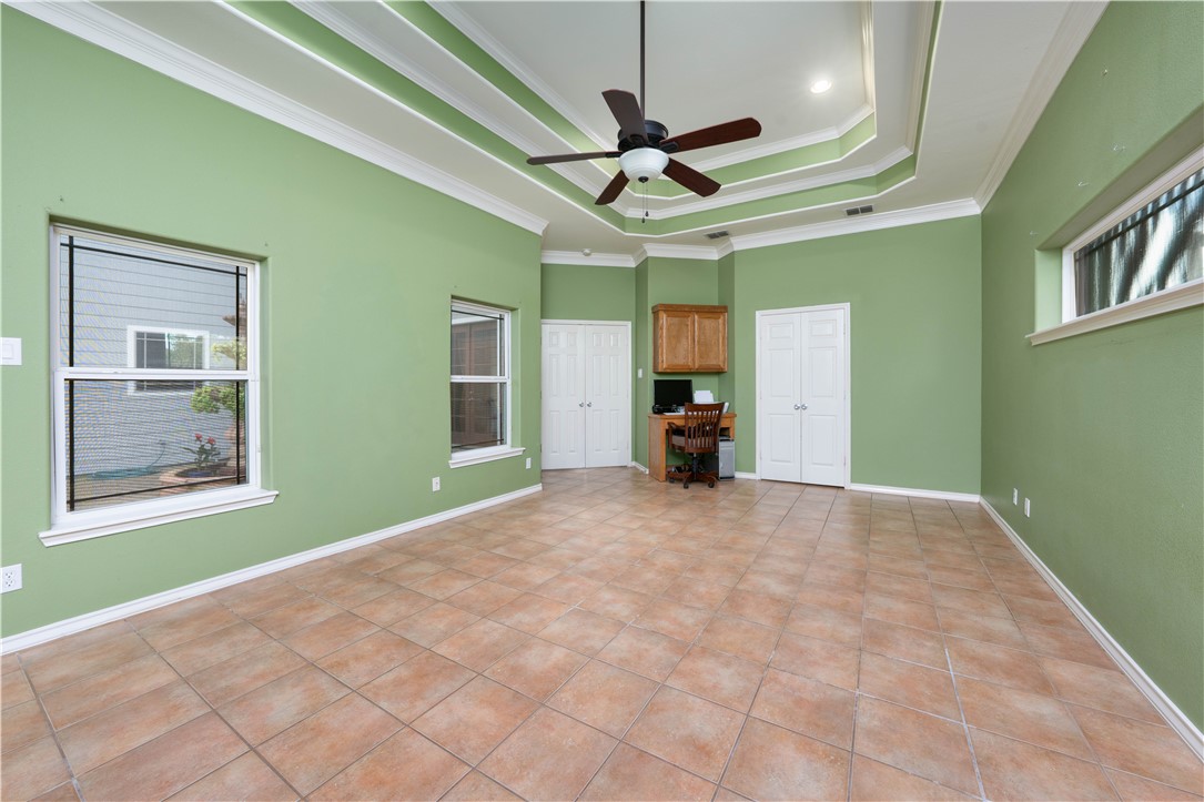 1034 Graham Road Corpus Christi, TX 78418 - Photo 9 of 40 a view of empty room with a ceiling fan and window