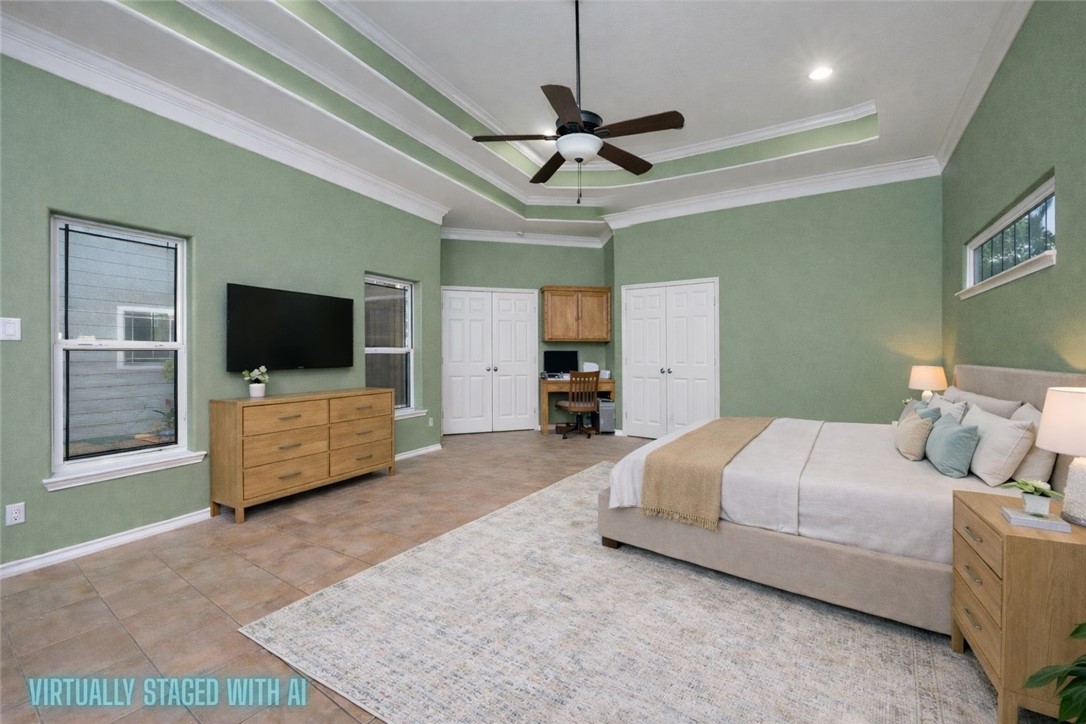 1034 Graham Road Corpus Christi, TX 78418 - Photo 10 of 40 a bedroom with a bed and a flat screen tv