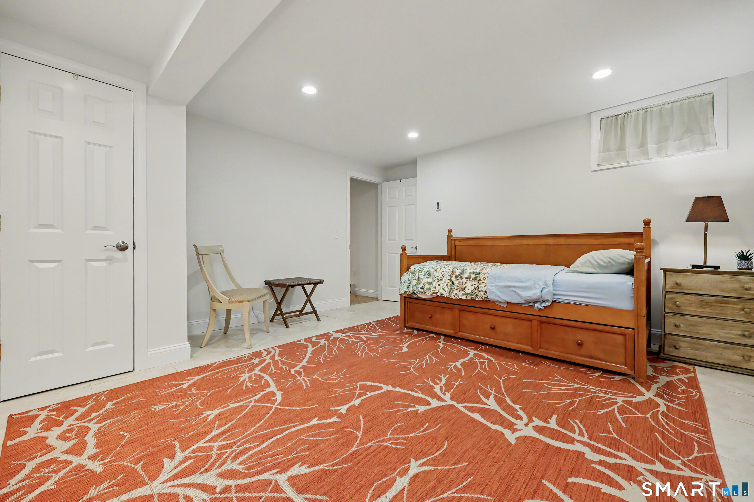 70 Fawn Ridge Lane, Unit 70 Norwalk, CT 06851 - Photo 19 of 36 a bedroom with a bed and a table