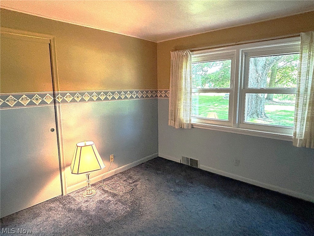 1961 Killian Road Akron, OH 44312 - Photo 17 of 23 Bedroom with hardwood under carpet