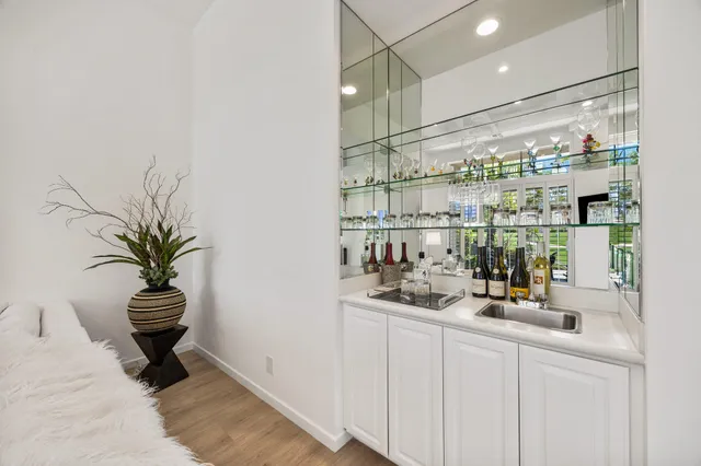 a kitchen with a sink and a refrigerator