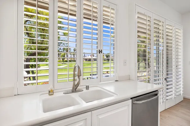 a bathroom with a sink and a large mirror