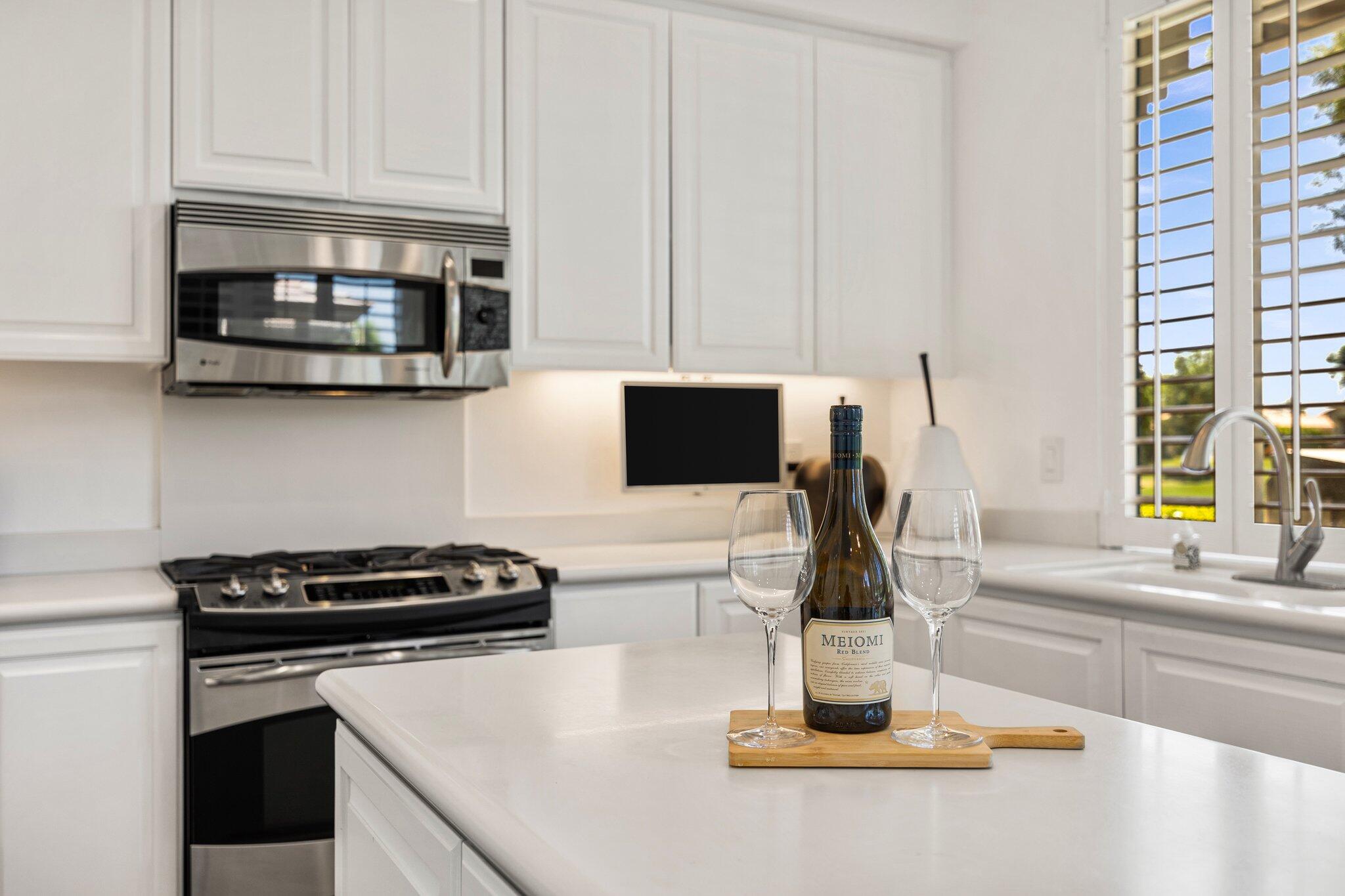 763 Box Canyon Trail Palm Desert, CA 92211 - Photo 19 of 48 a kitchen with a stove and a white cabinets