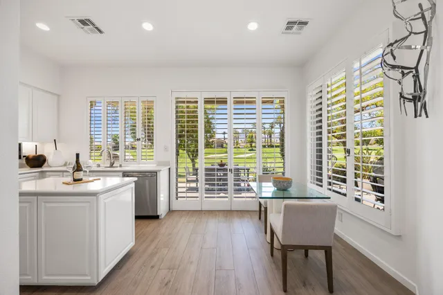 a kitchen with sink and wooden cabinets