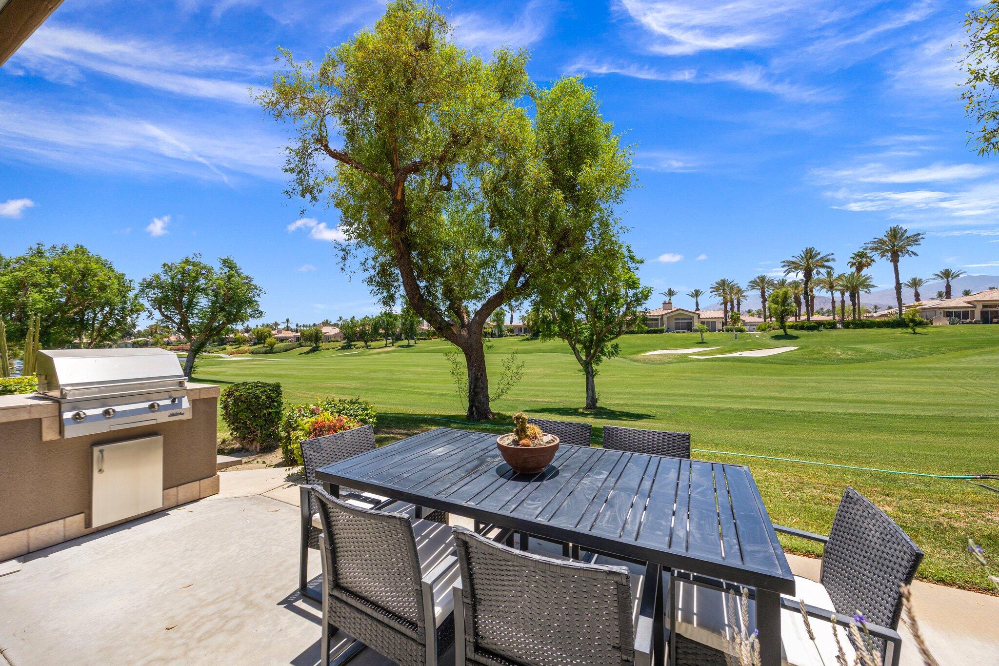 763 Box Canyon Trail Palm Desert, CA 92211 - Photo 2 of 48 a view of a patio with swimming pool