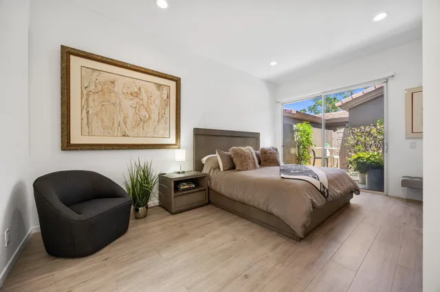 a spacious bedroom with a bed and a couch