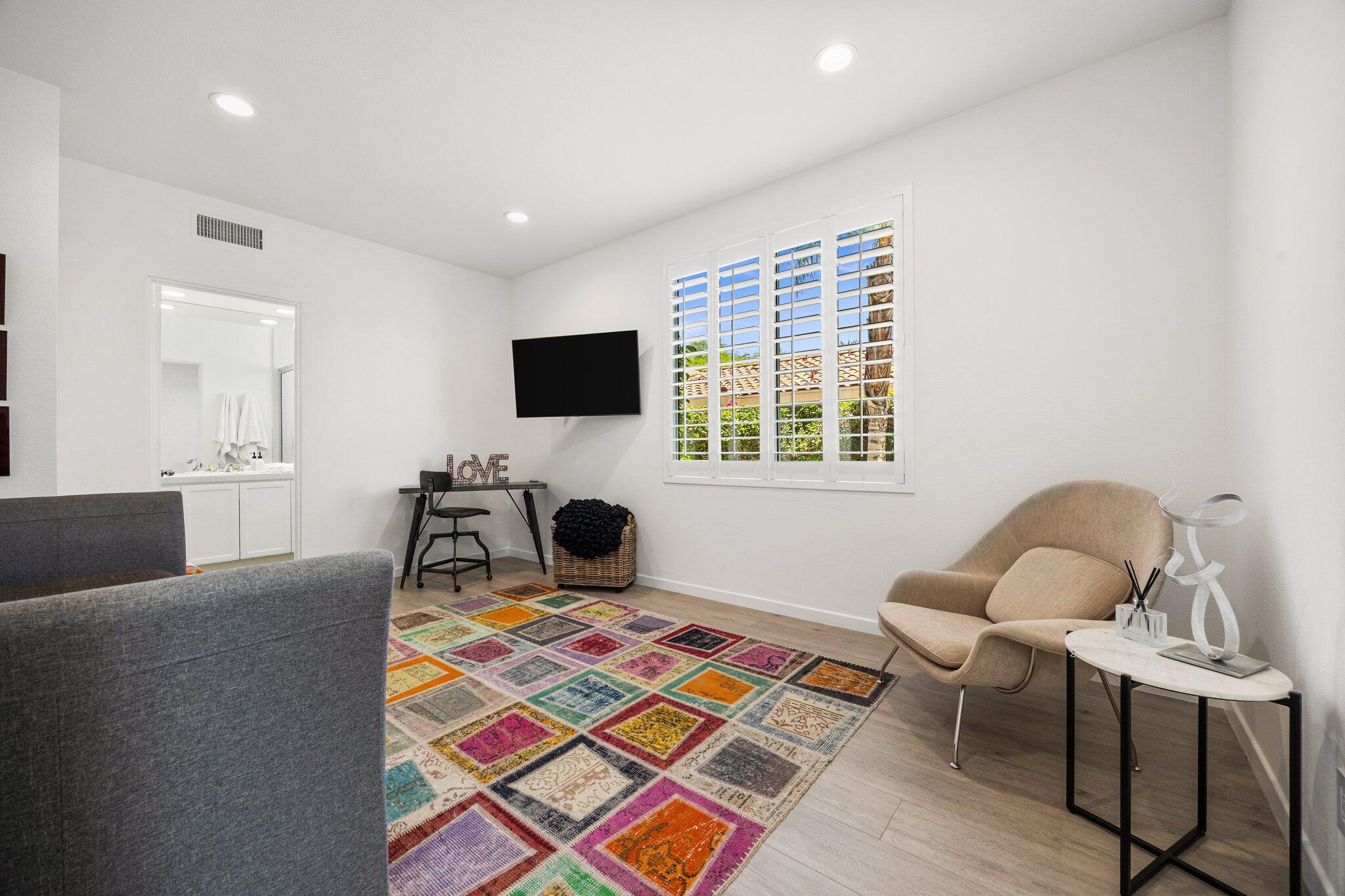763 Box Canyon Trail Palm Desert, CA 92211 - Photo 29 of 48 a living room with furniture and a flat screen tv