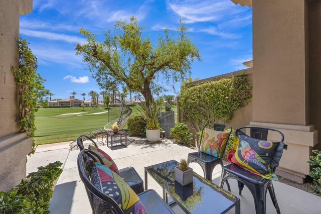 a view of an outdoor sitting area with furniture