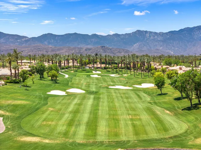 a view of an aerial view of residential houses with outdoor space and garden