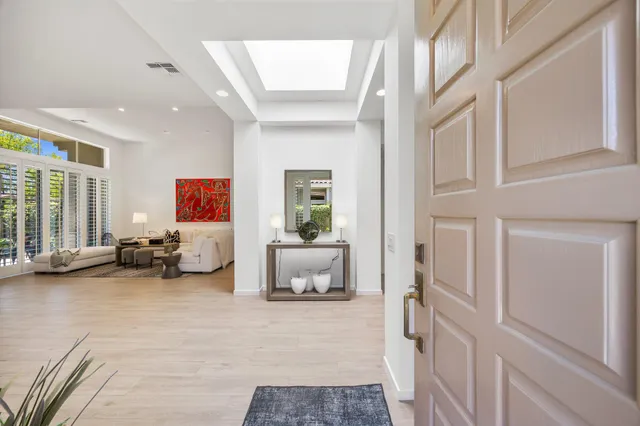 a view of a livingroom with furniture and a flat screen tv