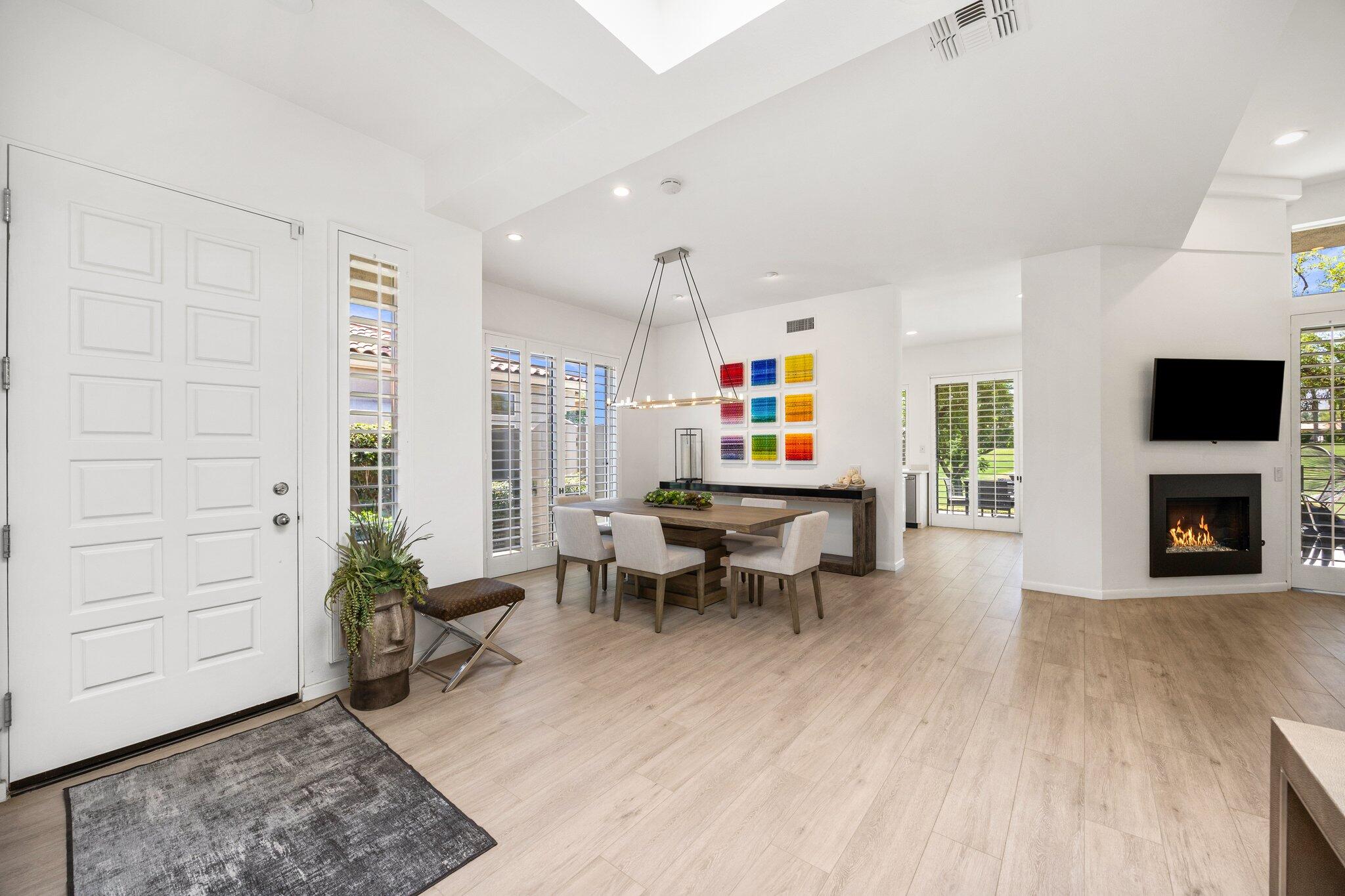 763 Box Canyon Trail Palm Desert, CA 92211 - Photo 9 of 48 a living room with furniture a fireplace and a flat screen tv