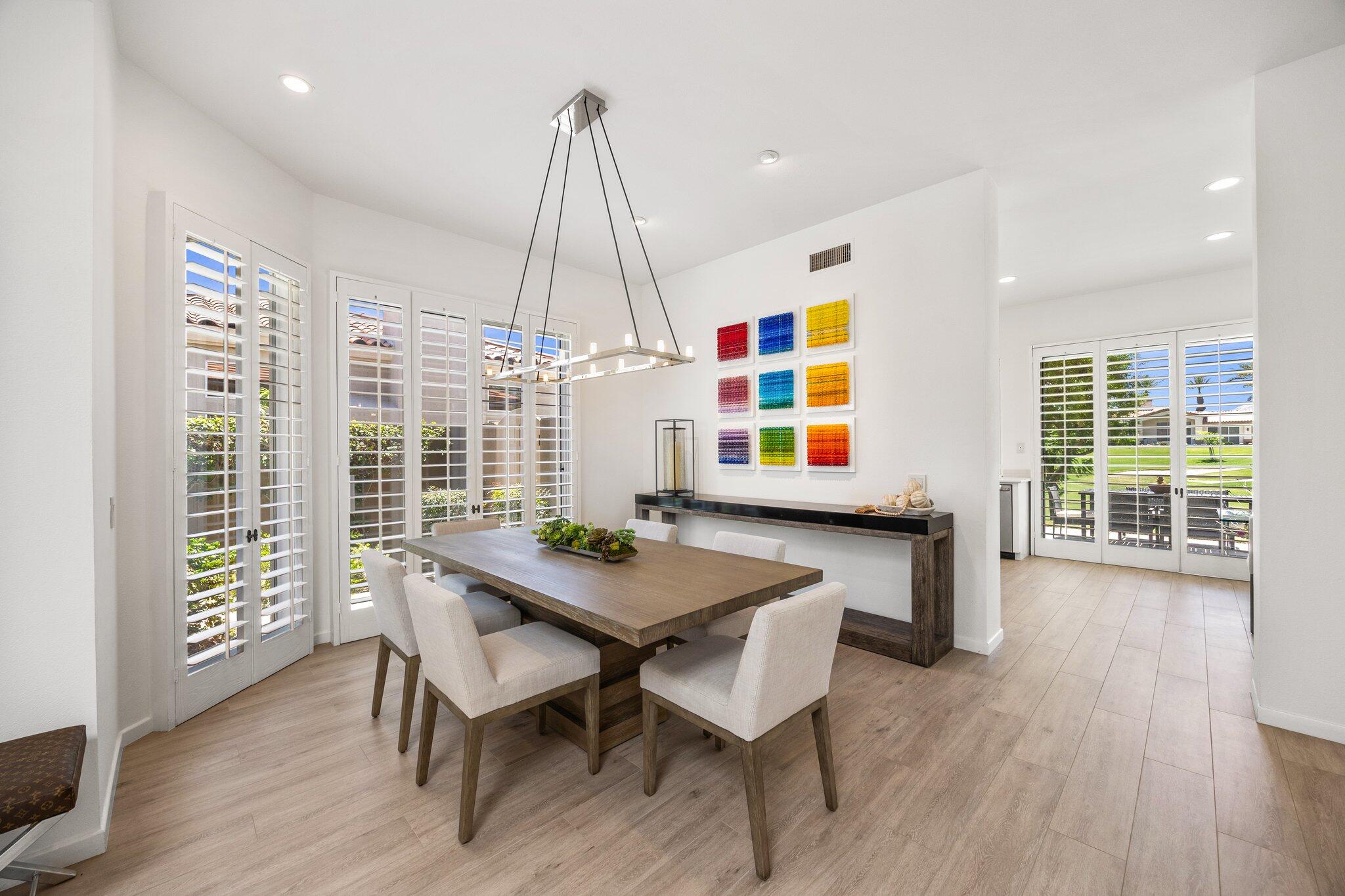 763 Box Canyon Trail Palm Desert, CA 92211 - Photo 10 of 48 a view of a dining room with furniture window and wooden floor