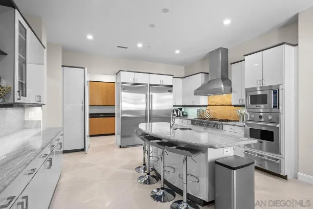 a kitchen with counter top space cabinets and stainless steel appliances