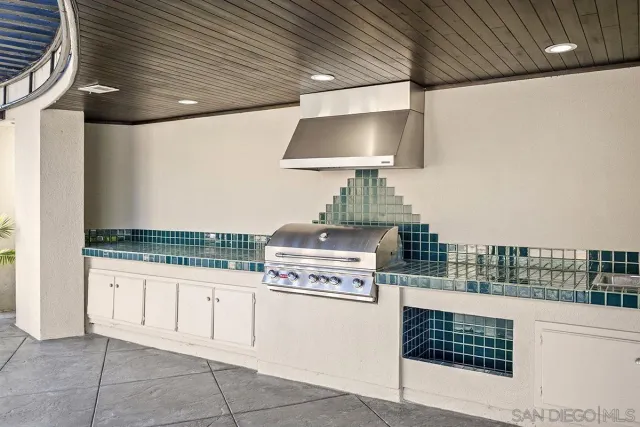 a kitchen with stainless steel appliances granite countertop a stove and a sink
