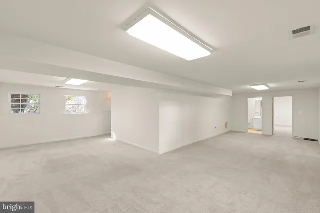 a view of an empty room and entryway