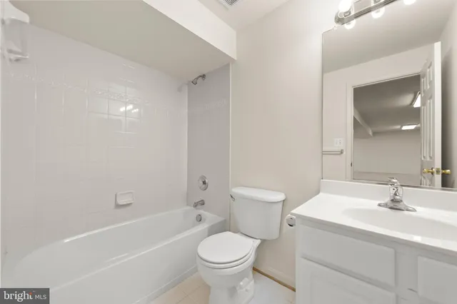 a view of room with wooden floor and window