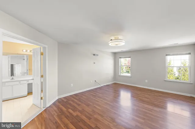 a bathroom with a shower sink and mirror