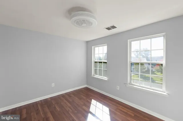 a view of a house with backyard porch and sitting area