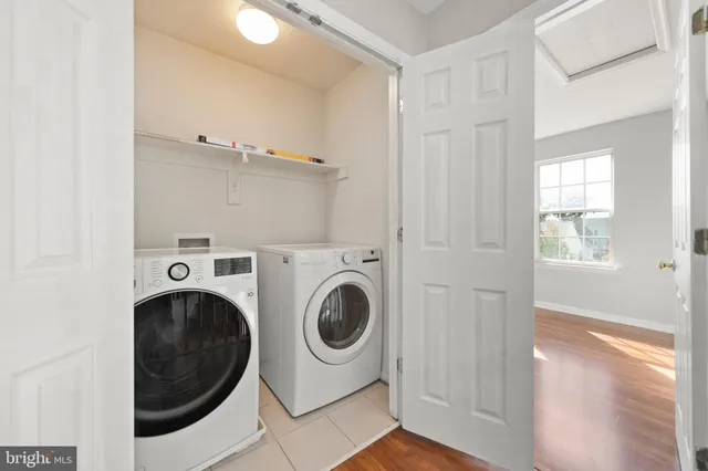 a front view of a house with potted plants
