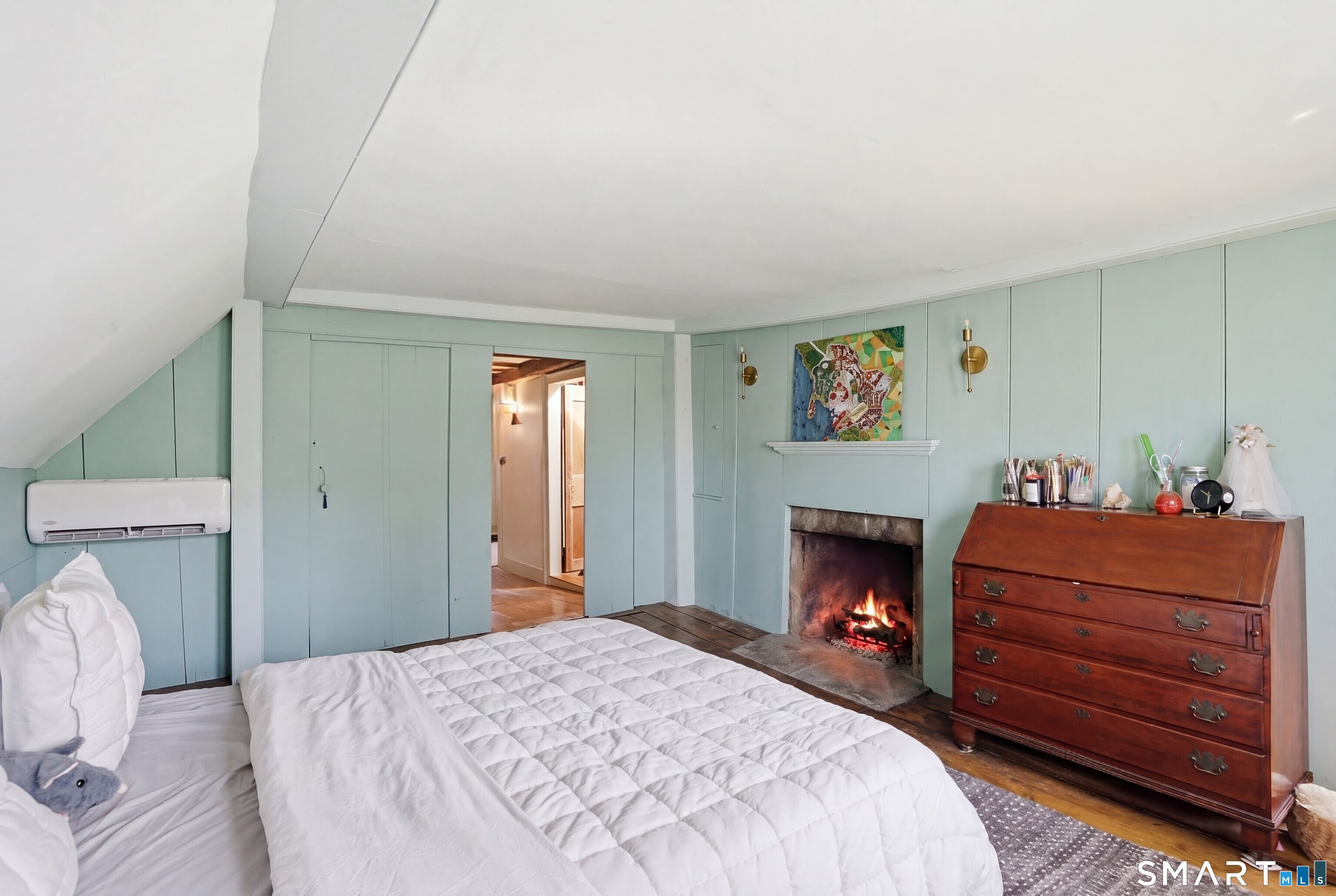 604 Pendleton Hill Road North Stonington, CT 06359 - Photo 30 of 39 a bedroom with a bed and a fireplace