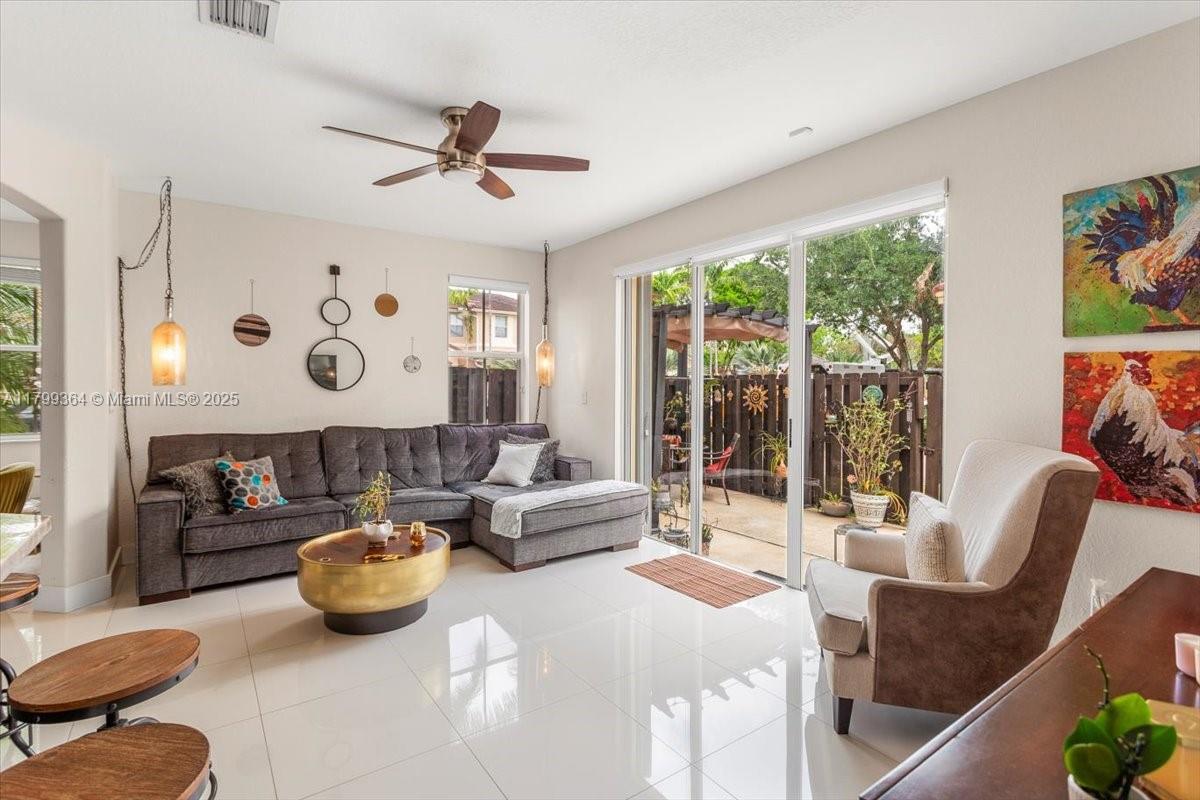 12367 Southwest 122nd Street Miami, FL 33186 - Photo 13 of 35 a living room with furniture and a large window