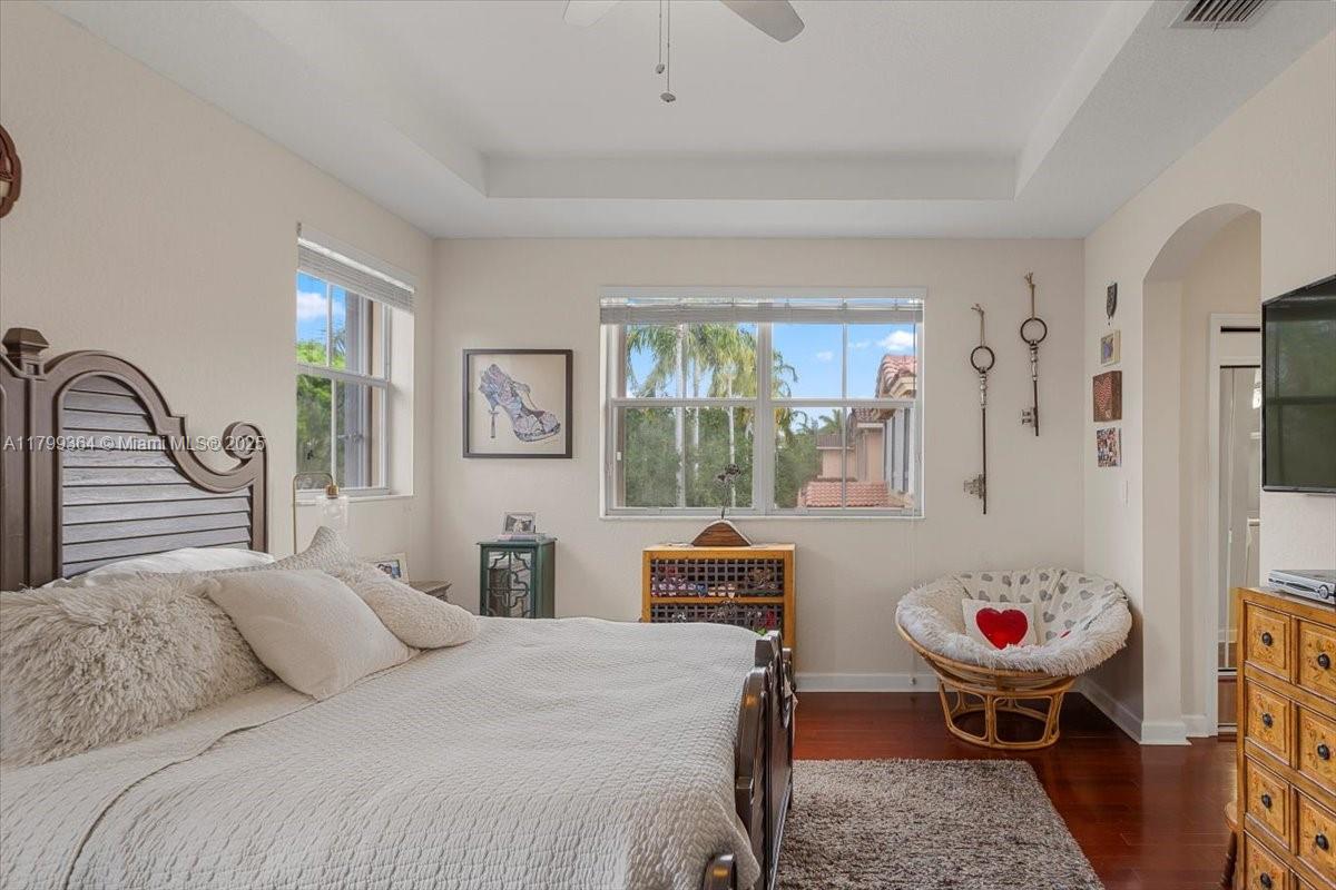 12367 Southwest 122nd Street Miami, FL 33186 - Photo 20 of 35 a bedroom with a bed and glass window