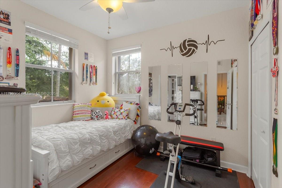 12367 Southwest 122nd Street Miami, FL 33186 - Photo 26 of 35 a bedroom with furniture and a window