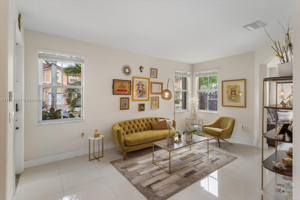 12367 Southwest 122nd Street Miami, FL 33186 - Photo 3 of 35 a living room with furniture rug and window