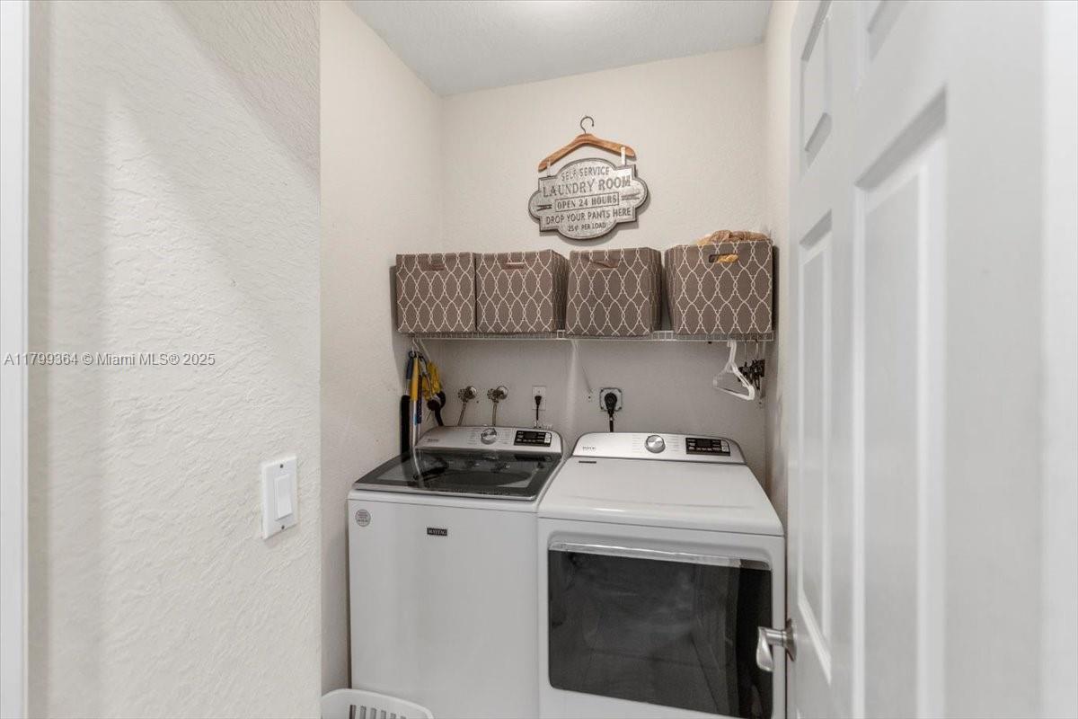 12367 Southwest 122nd Street Miami, FL 33186 - Photo 33 of 35 a kitchen with a stove and a sink