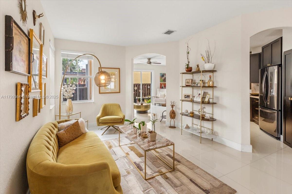 12367 Southwest 122nd Street Miami, FL 33186 - Photo 5 of 35 a living room with furniture window and white walls