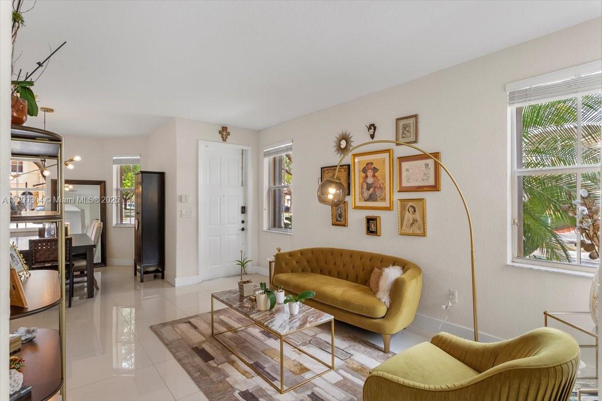 12367 Southwest 122nd Street Miami, FL 33186 - Photo 7 of 35 a living room with furniture and a large window