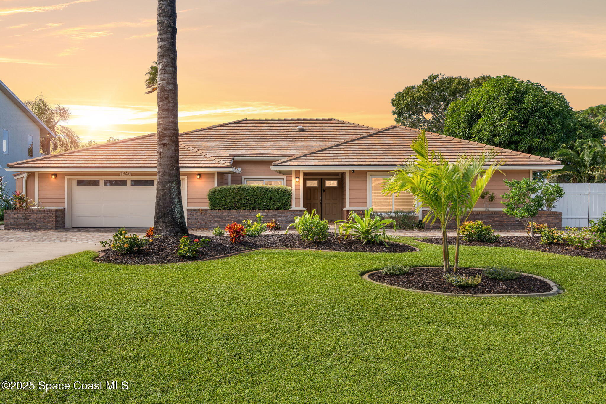1940 Gates Road Merritt Island, FL 32952 - Photo 1 of 72 a front view of a house with a yard