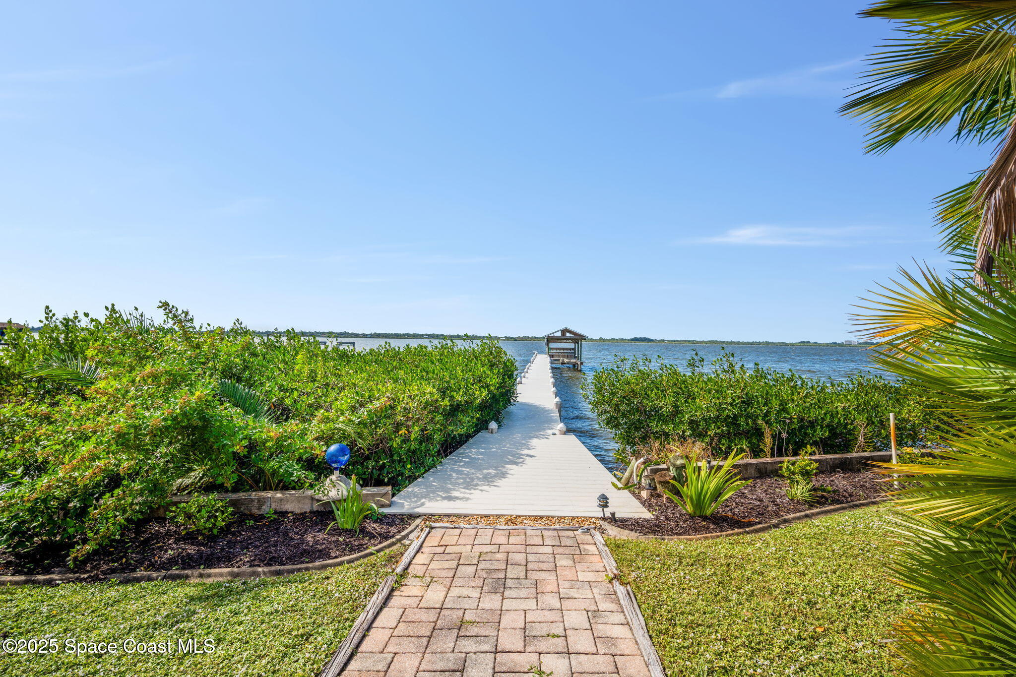 1940 Gates Road Merritt Island, FL 32952 - Photo 11 of 72 a view of a garden with lawn chairs