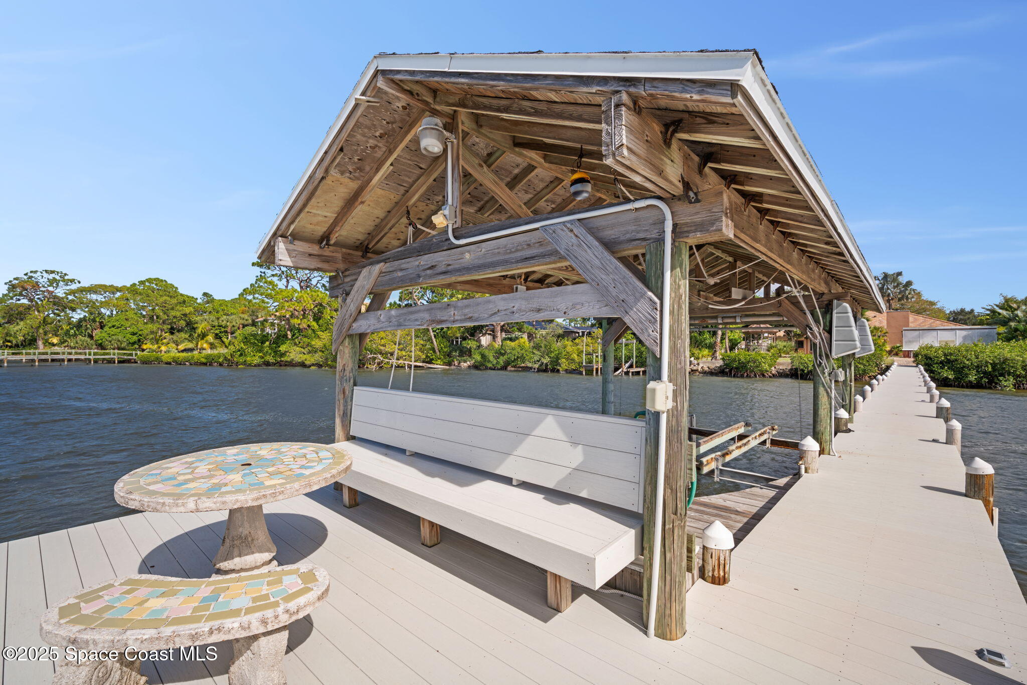 1940 Gates Road Merritt Island, FL 32952 - Photo 12 of 72 a view of a two chair and table in the balcony