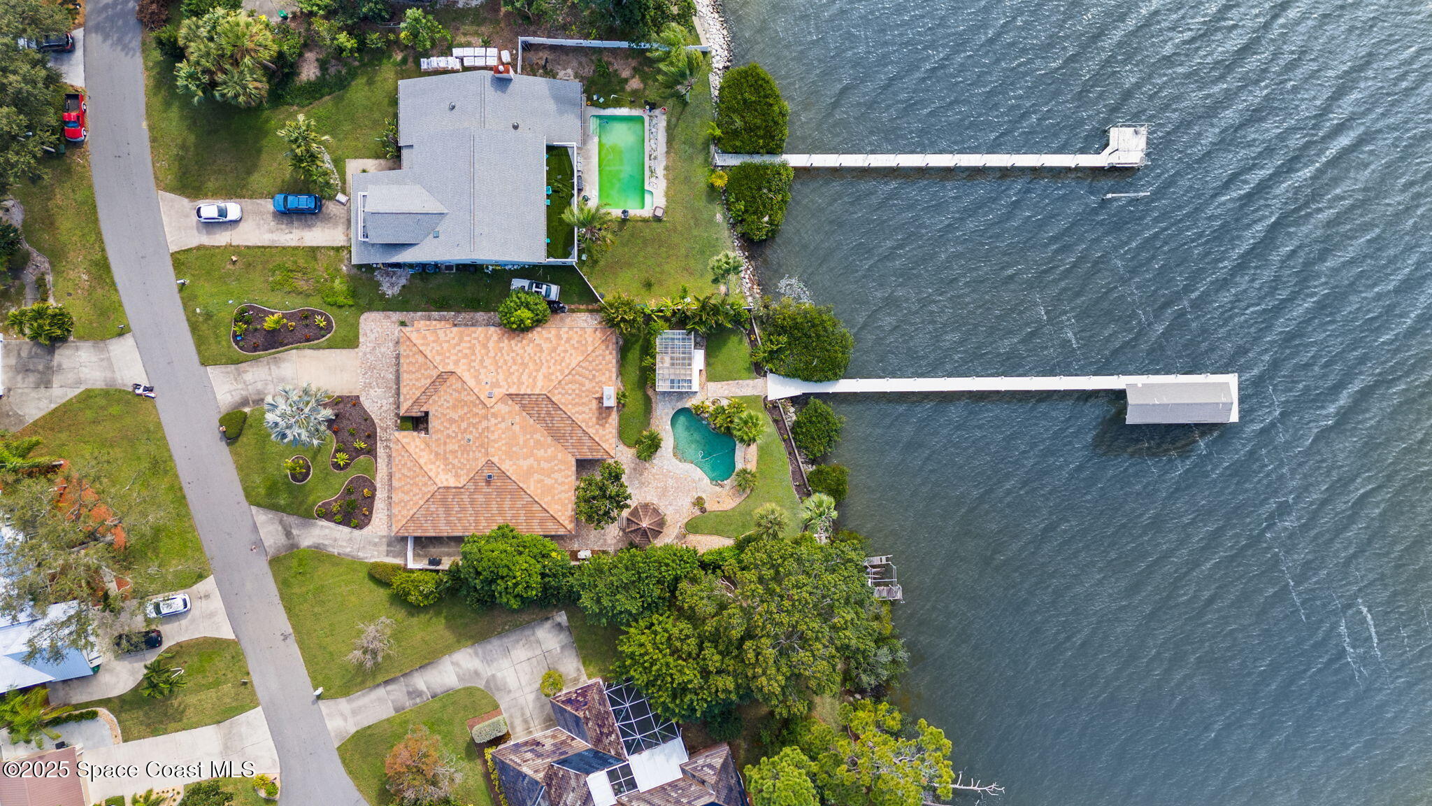 1940 Gates Road Merritt Island, FL 32952 - Photo 17 of 72 an aerial view of a house with a yard basket ball court