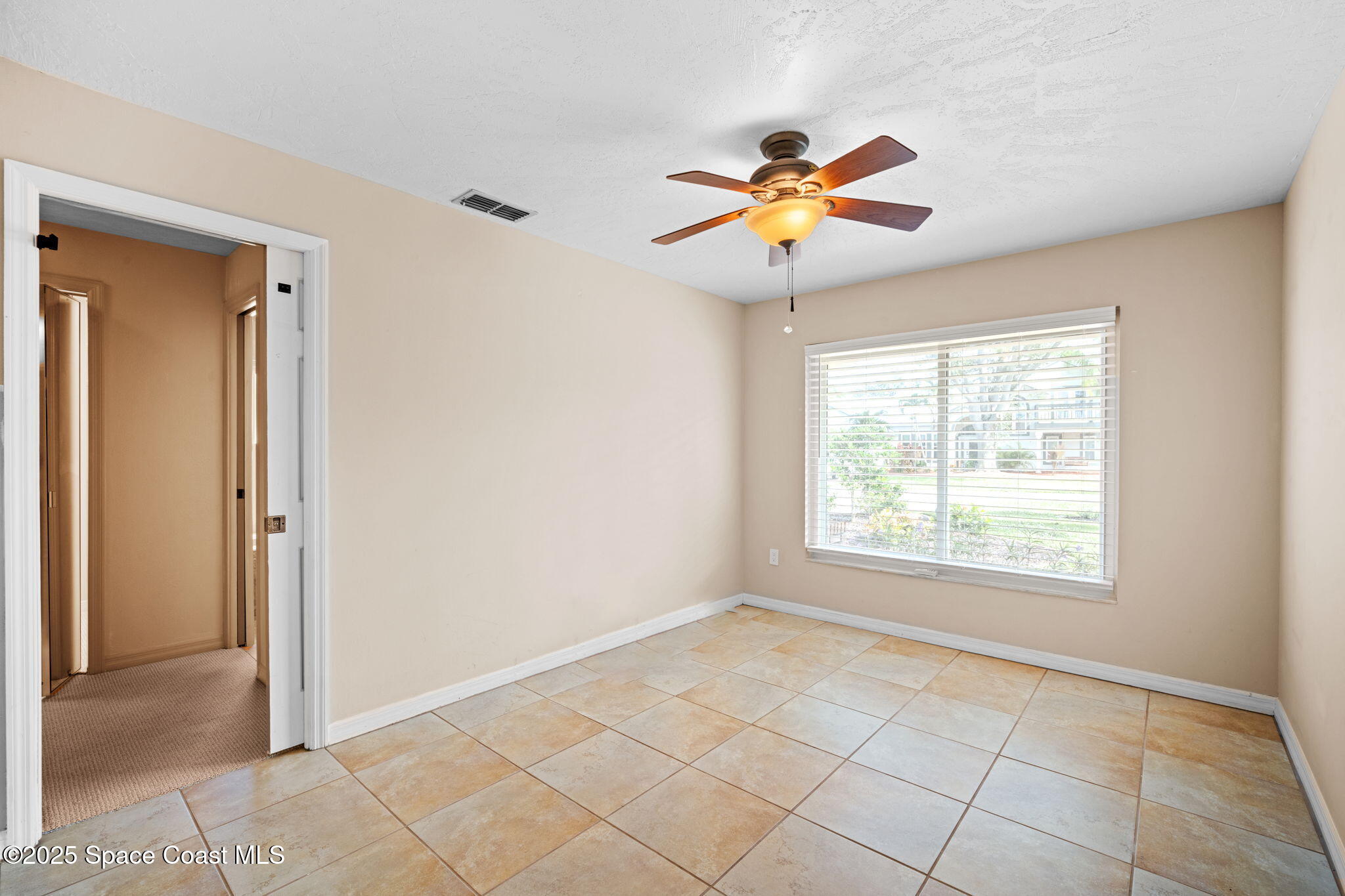 1940 Gates Road Merritt Island, FL 32952 - Photo 26 of 72 a view of an empty room with a window