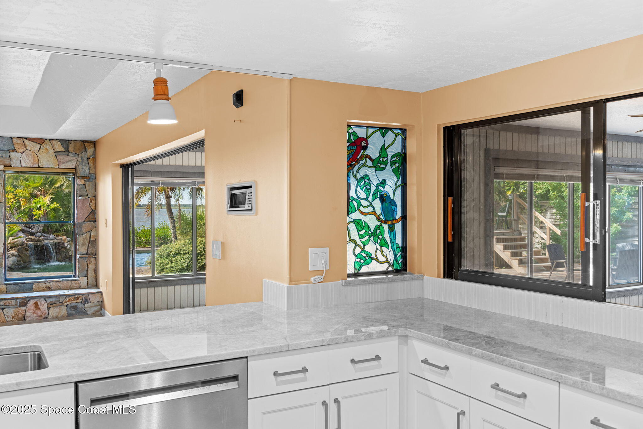 1940 Gates Road Merritt Island, FL 32952 - Photo 54 of 72 a kitchen with a window and tub