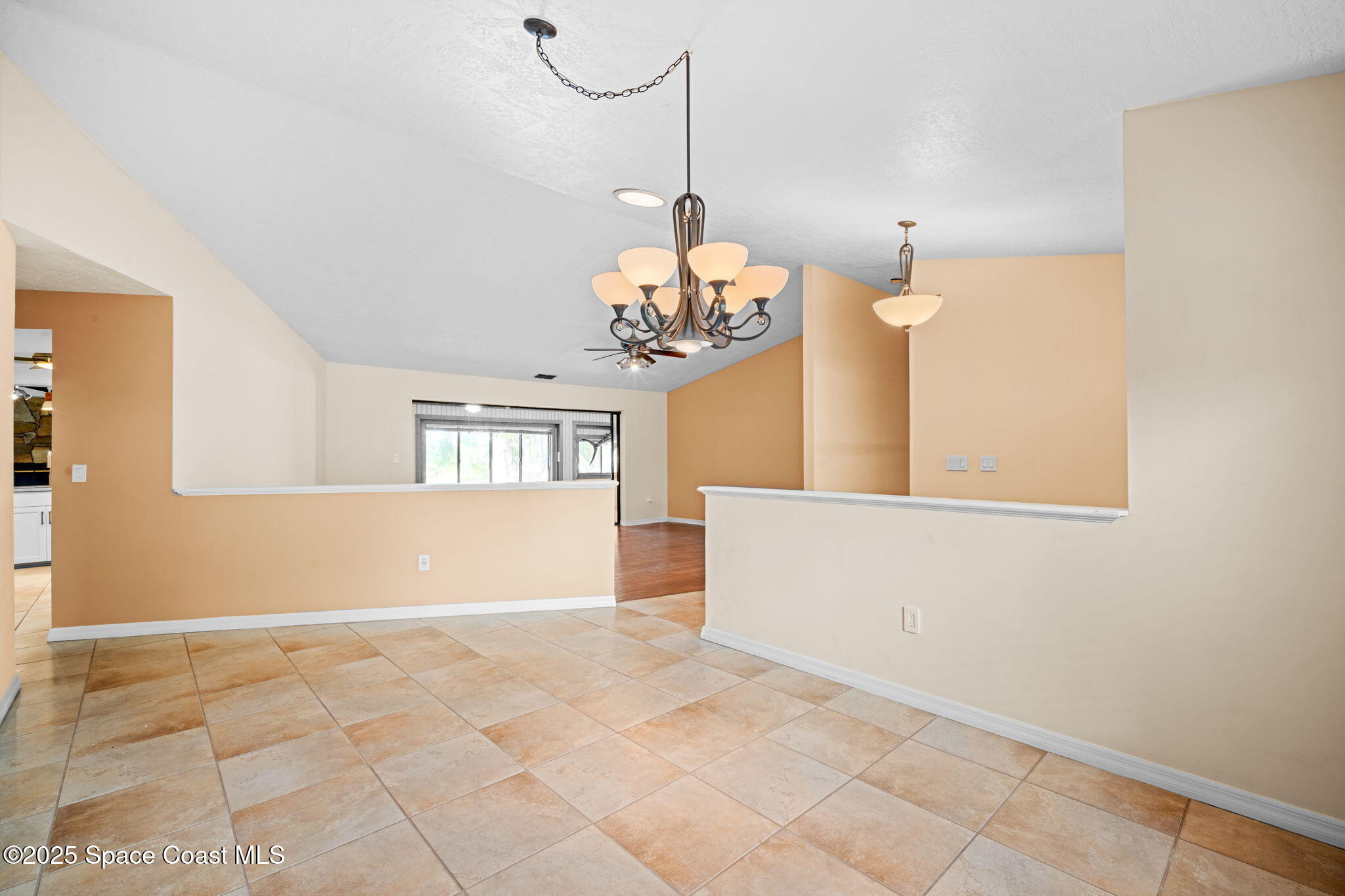 1940 Gates Road Merritt Island, FL 32952 - Photo 62 of 72 a view of a room with window and chandelier