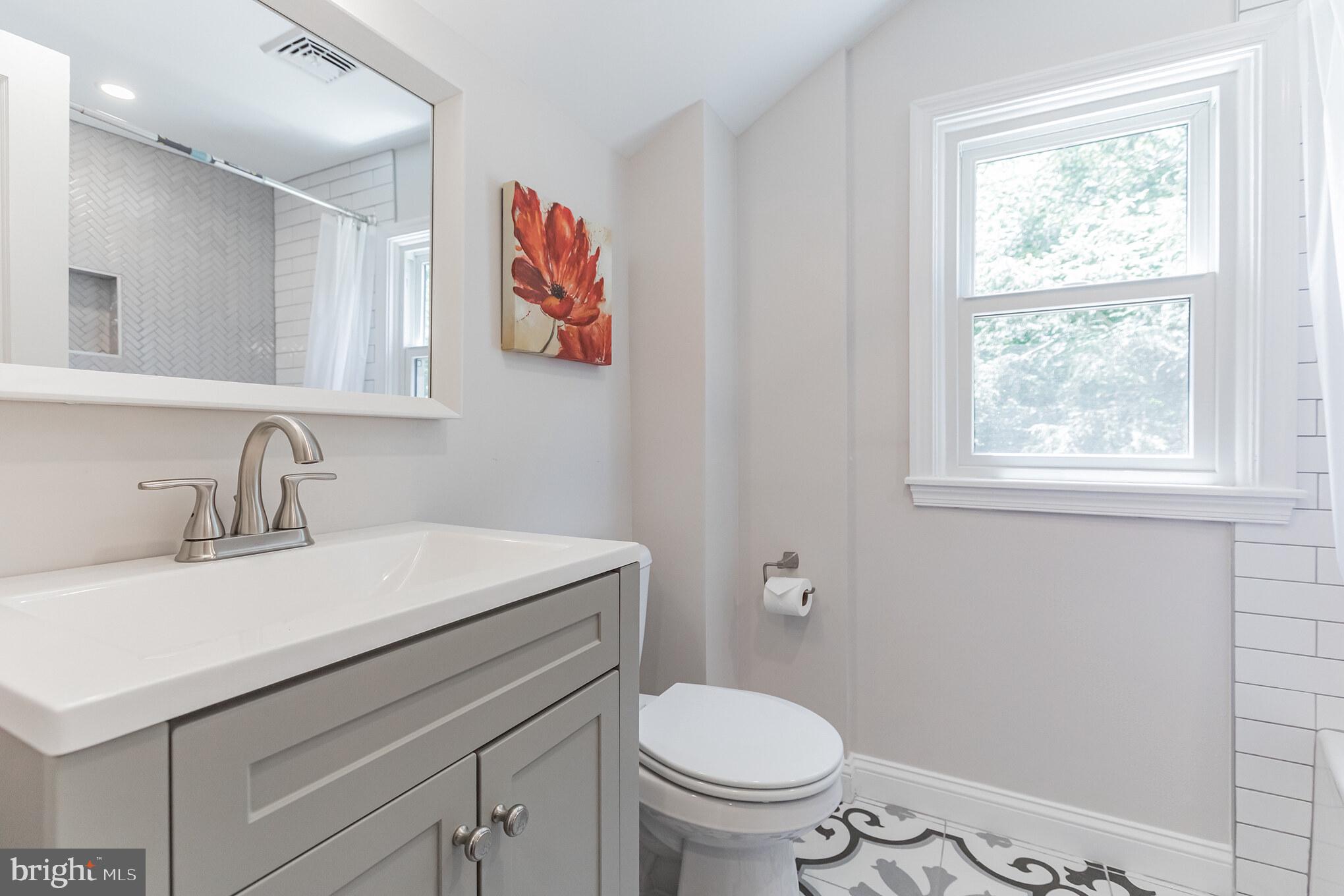 738 Hemlock Road Media, PA 19063 - Photo 11 of 16 Hall Bath with Subway and Herringbone