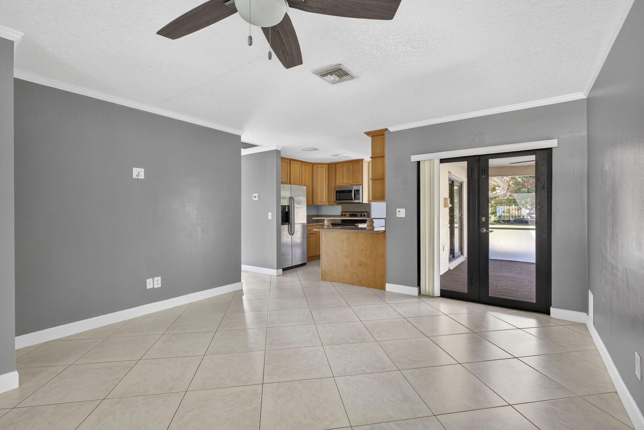 7107 181st Street Jupiter, FL 33458 - Photo 17 of 54 a view of a kitchen with a sink and a refrigerator