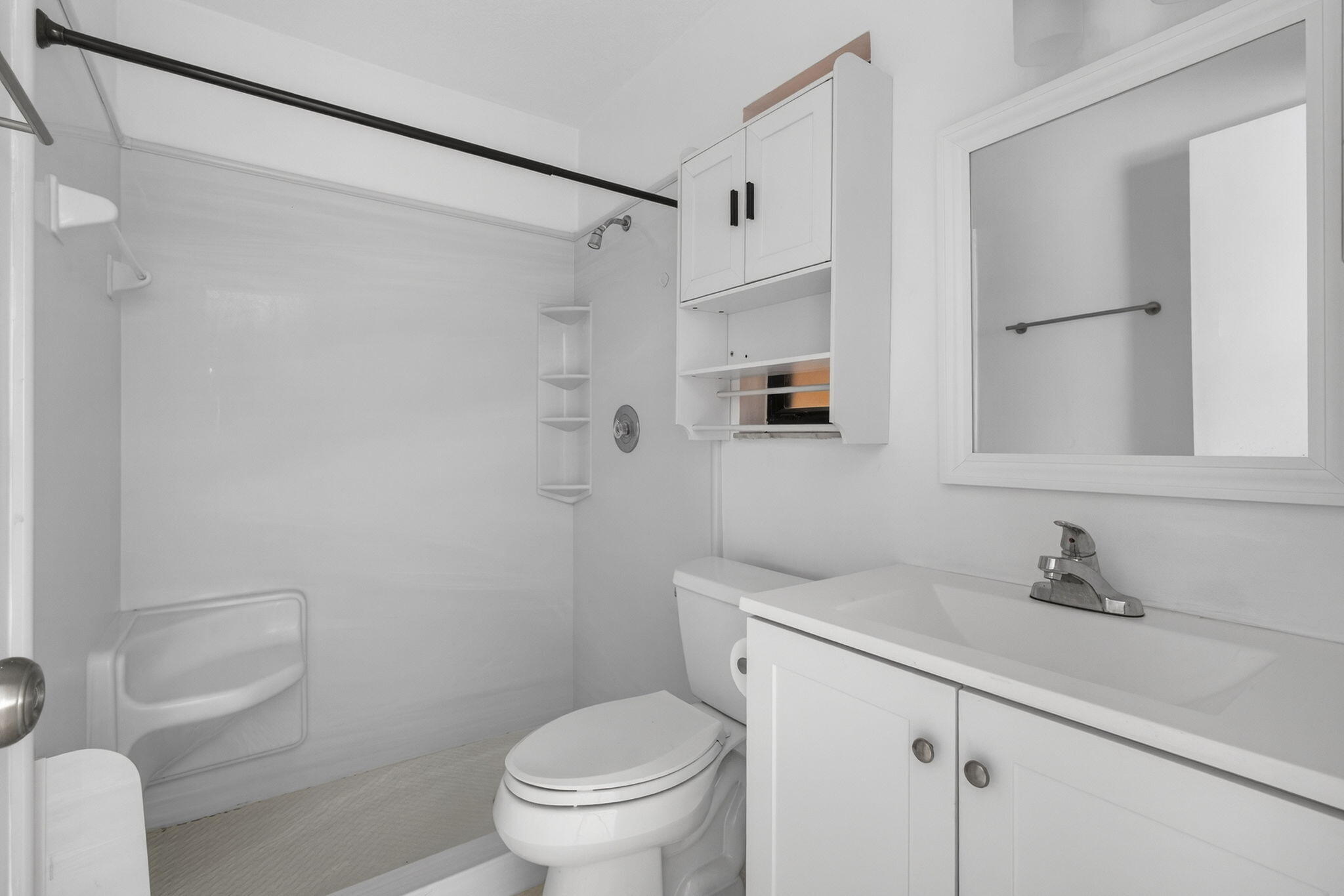 7107 181st Street Jupiter, FL 33458 - Photo 22 of 54 a bathroom with a sink toilet and shower